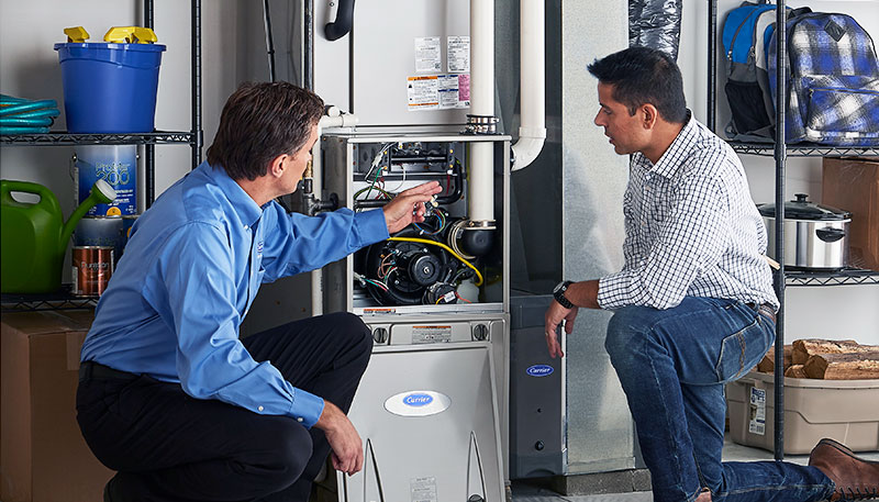 HVAC technician evaluating a furnace for repair or replacement in Apache Junction