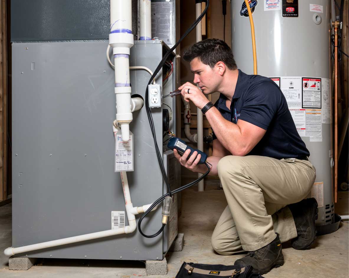 HVAC technician performing a furnace tune-up in Apache Junction