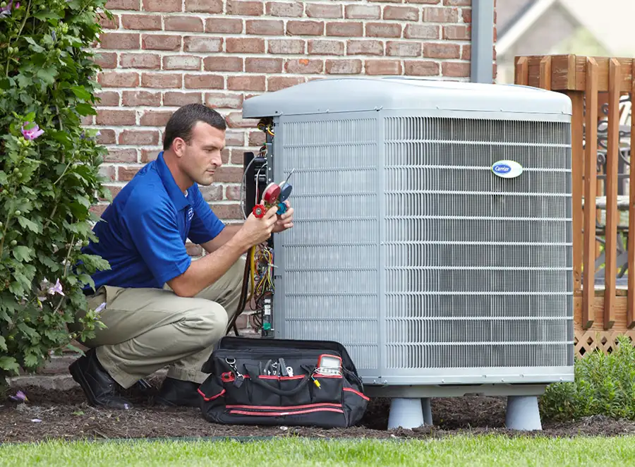HVAC technician inspecting an outdoor air conditioning unit in Apache Junction